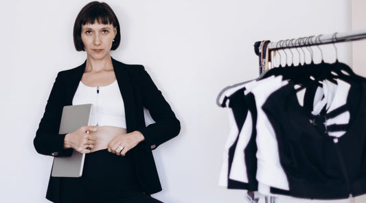 Etalon founder standing confidently, representing her journey from idea to successful posture bra.