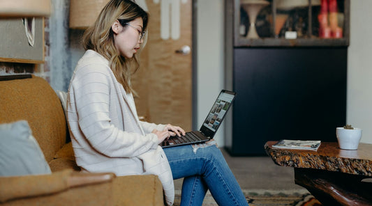 Man working on laptop with forward head posture.