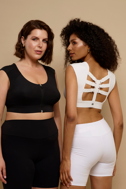 A black Etalon 2.0 posture corrector bra shown from the front and a white version from the side, emphasizing adjustable support.