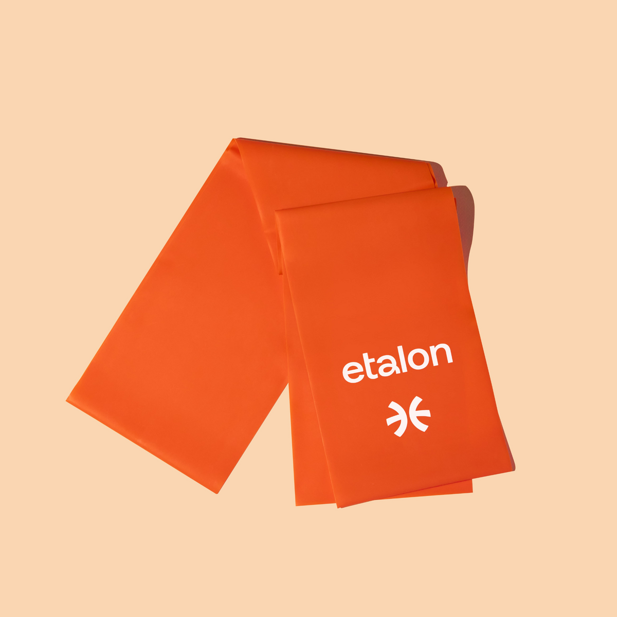 An orange Etalon elastic exercise band designed to improve posture and strengthen core and shoulder muscles.