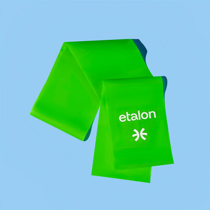 A green Etalon fitness band, designed for posture improvement and workouts.