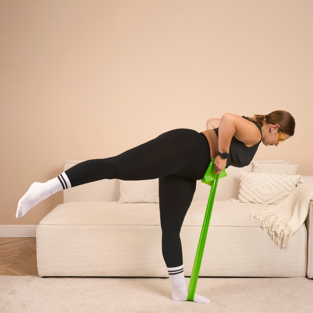 Resistance‑band spinal mobility exercise demonstrating enhanced flexibility and spinal alignment for fluid movement and posture correction with the Etalon posture band.