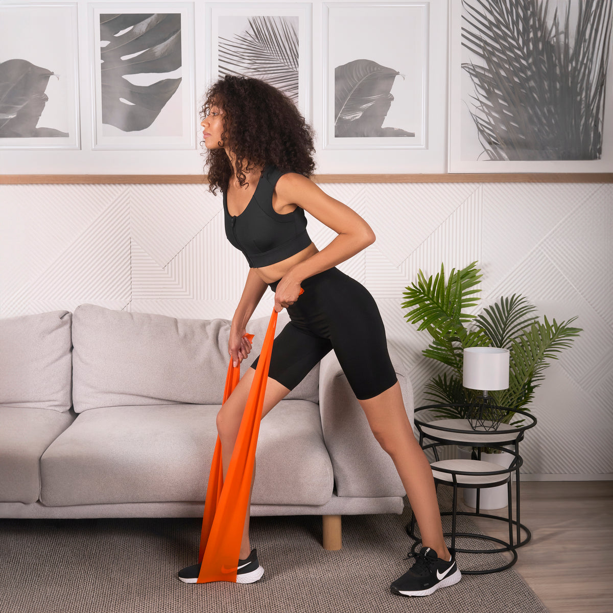 Orange workout band to engage back muscles.